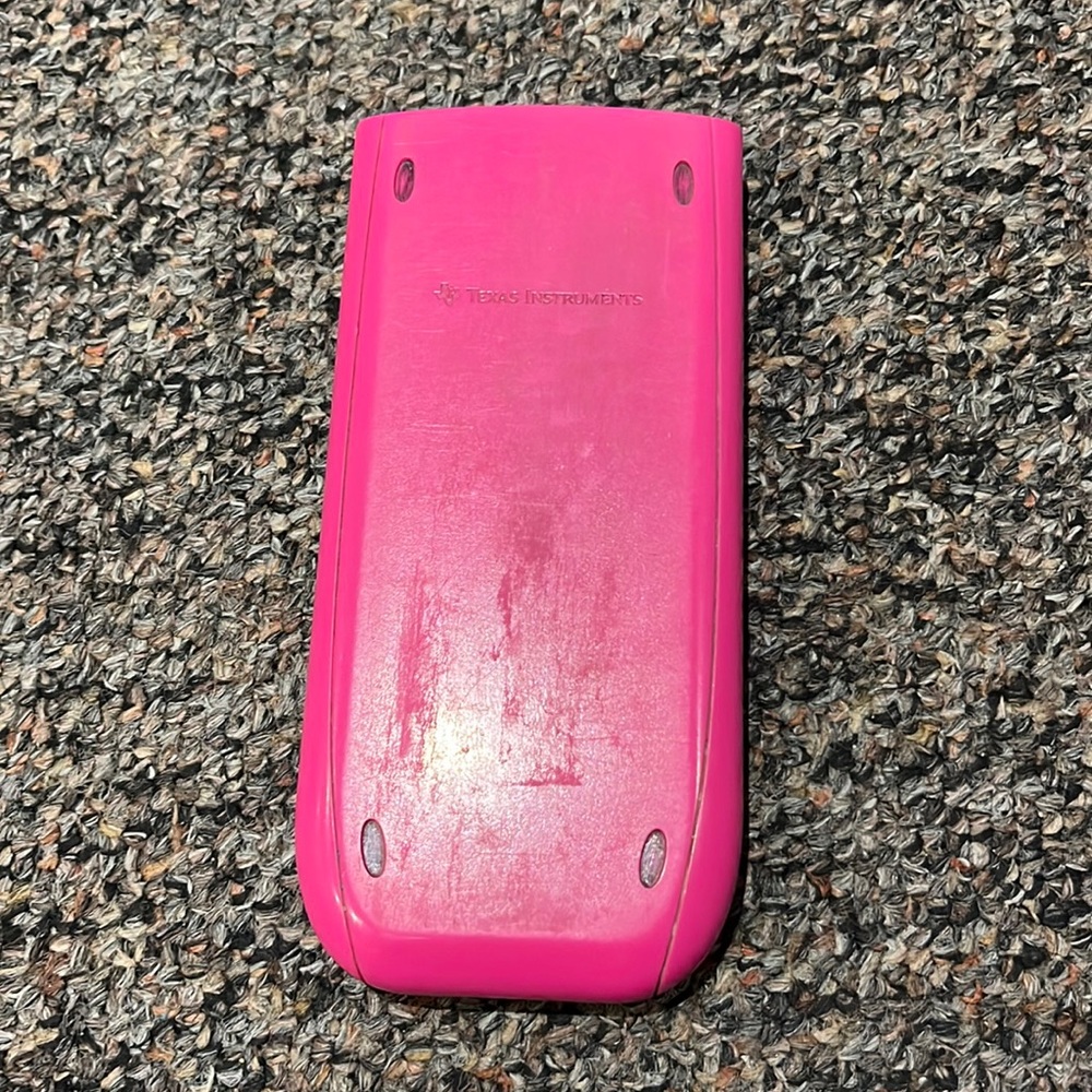 Pink TI 84 graphing calculator